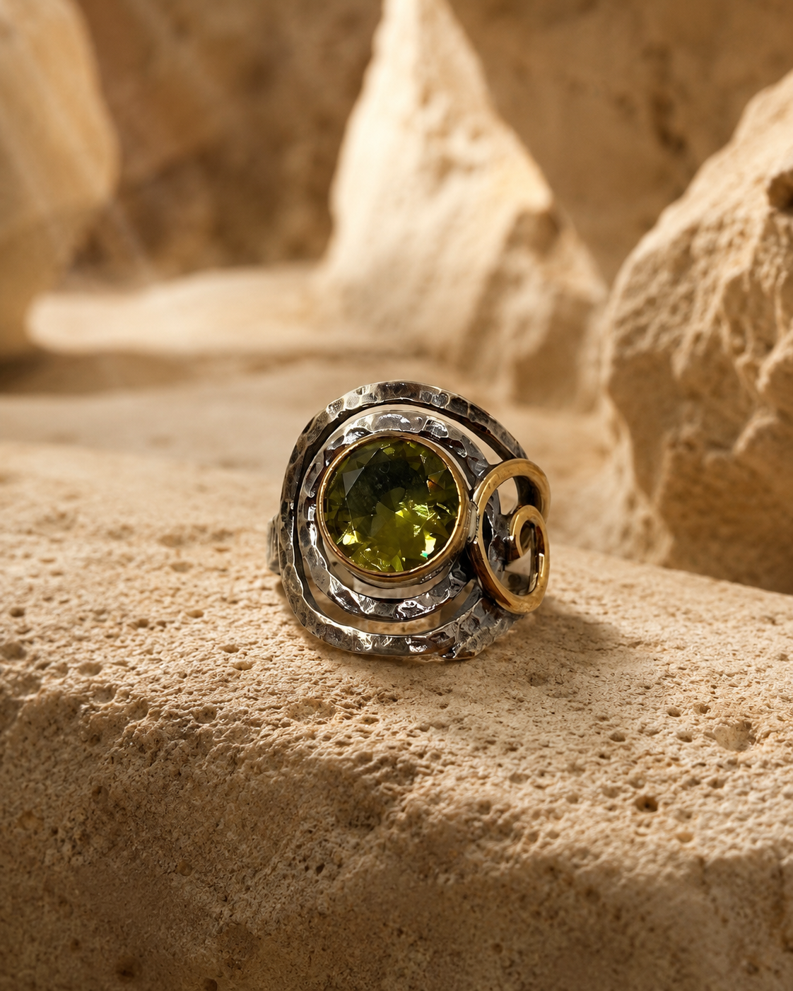 Spiral frame 925 sterling silver ring with round zultanite stone and bronze-toned detail on white background