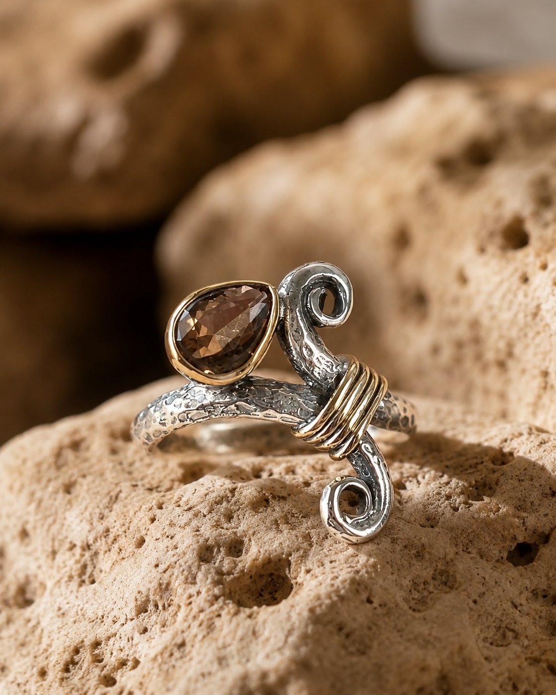 Spiral form 925 sterling silver ring with zultanite stone and bronze wrap detail on cave details