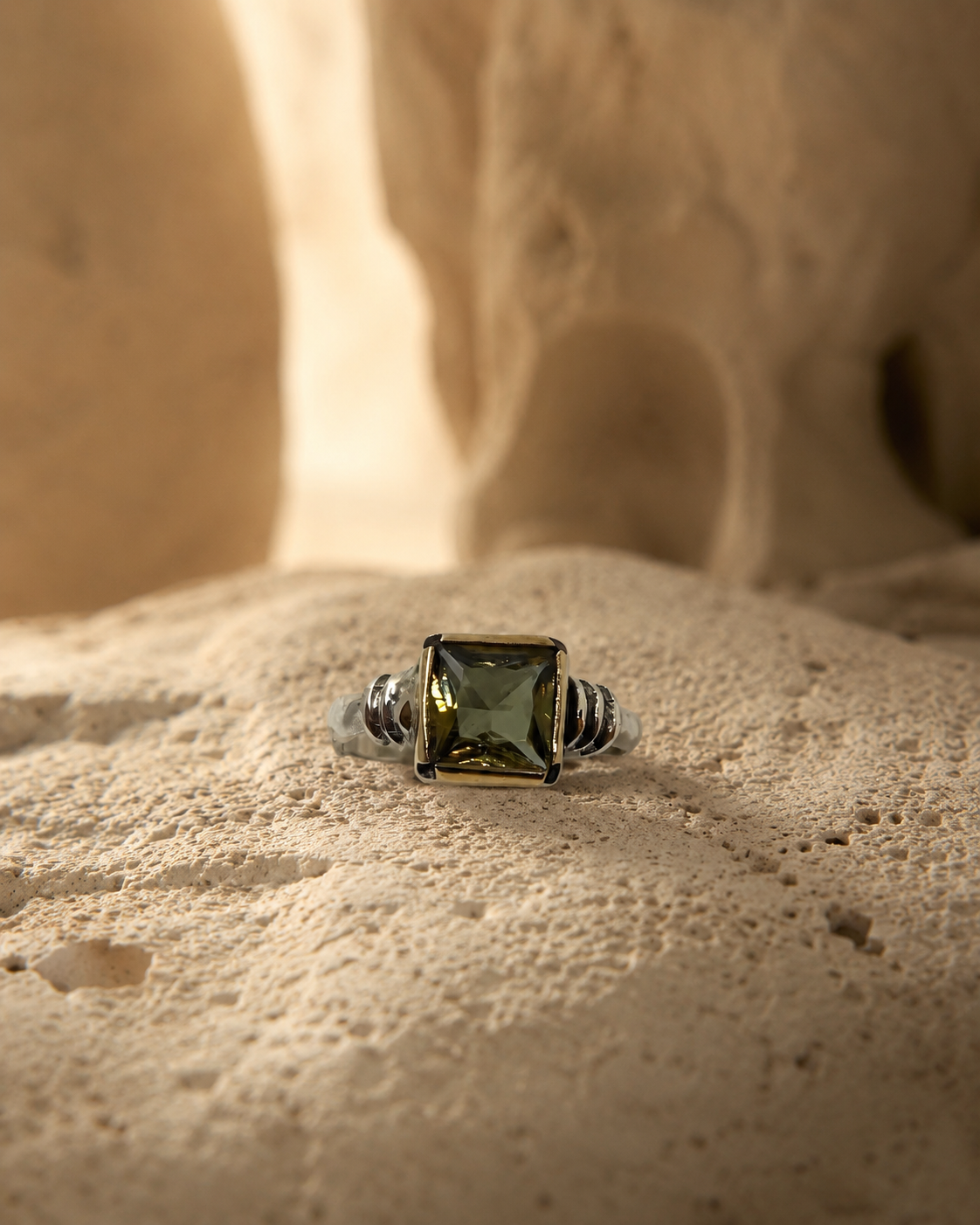 Minimal 925 sterling silver ring with square zultanite stone and gold-toned bezel on cappadocia cave