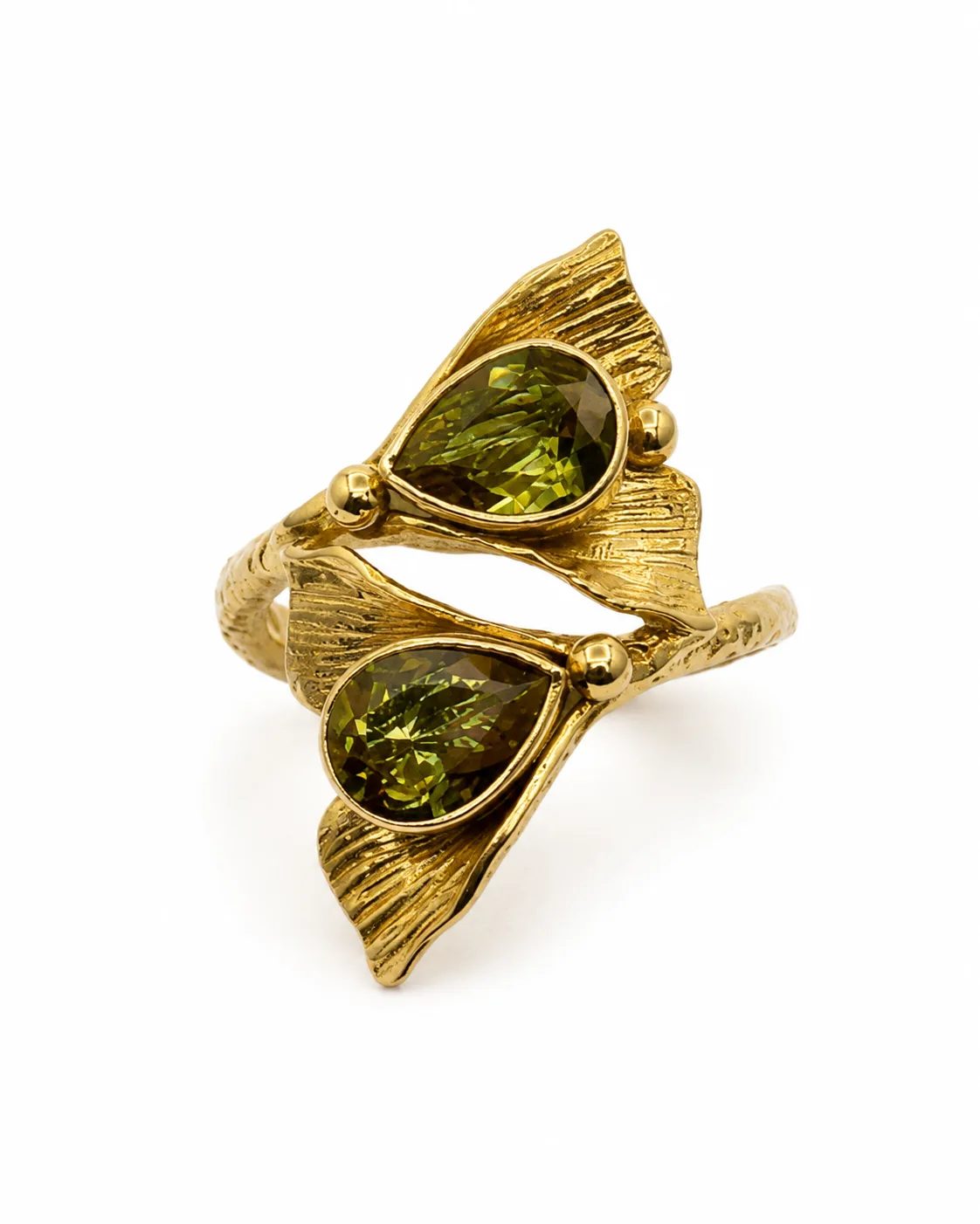 Gold plated sterling silver ring with two pear-shaped green zultanite stones and sculptural leaf details