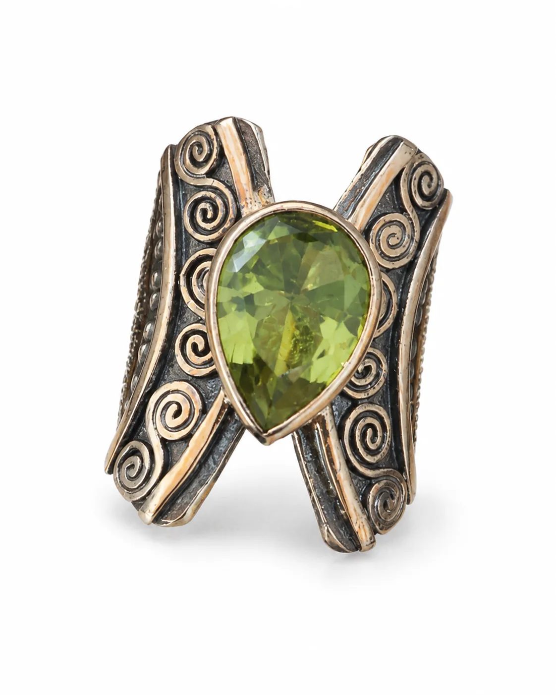 Scrollwork zultanite mixed metal statement ring with a pear-shaped green gemstone and oxidized decorative details on a white background