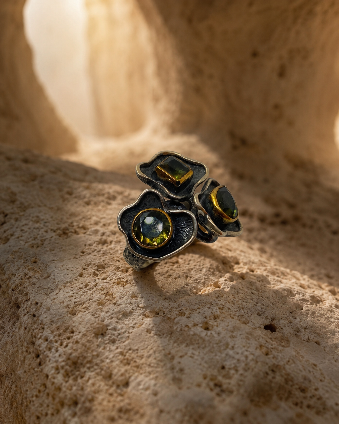 Floral trio 925 sterling silver ring with three zultanite stones and gold-toned bezel details on white background