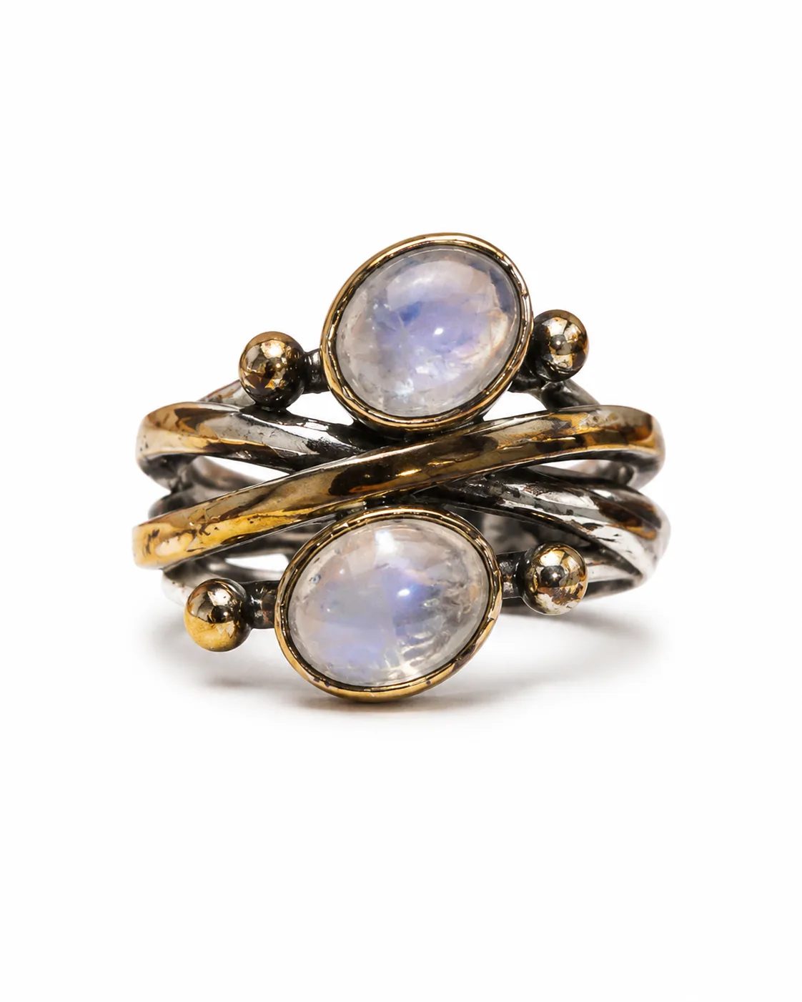 Double moonstone silver ring with bronze-toned bezels and open wrap band on a white background