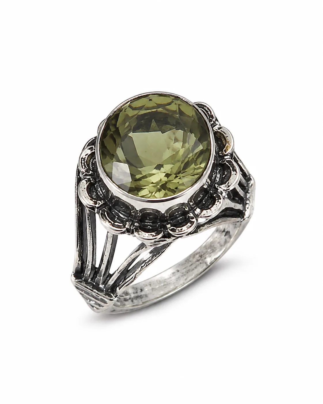 Round zultanite silver ring with a faceted green gemstone in an ornate oxidized handcrafted setting