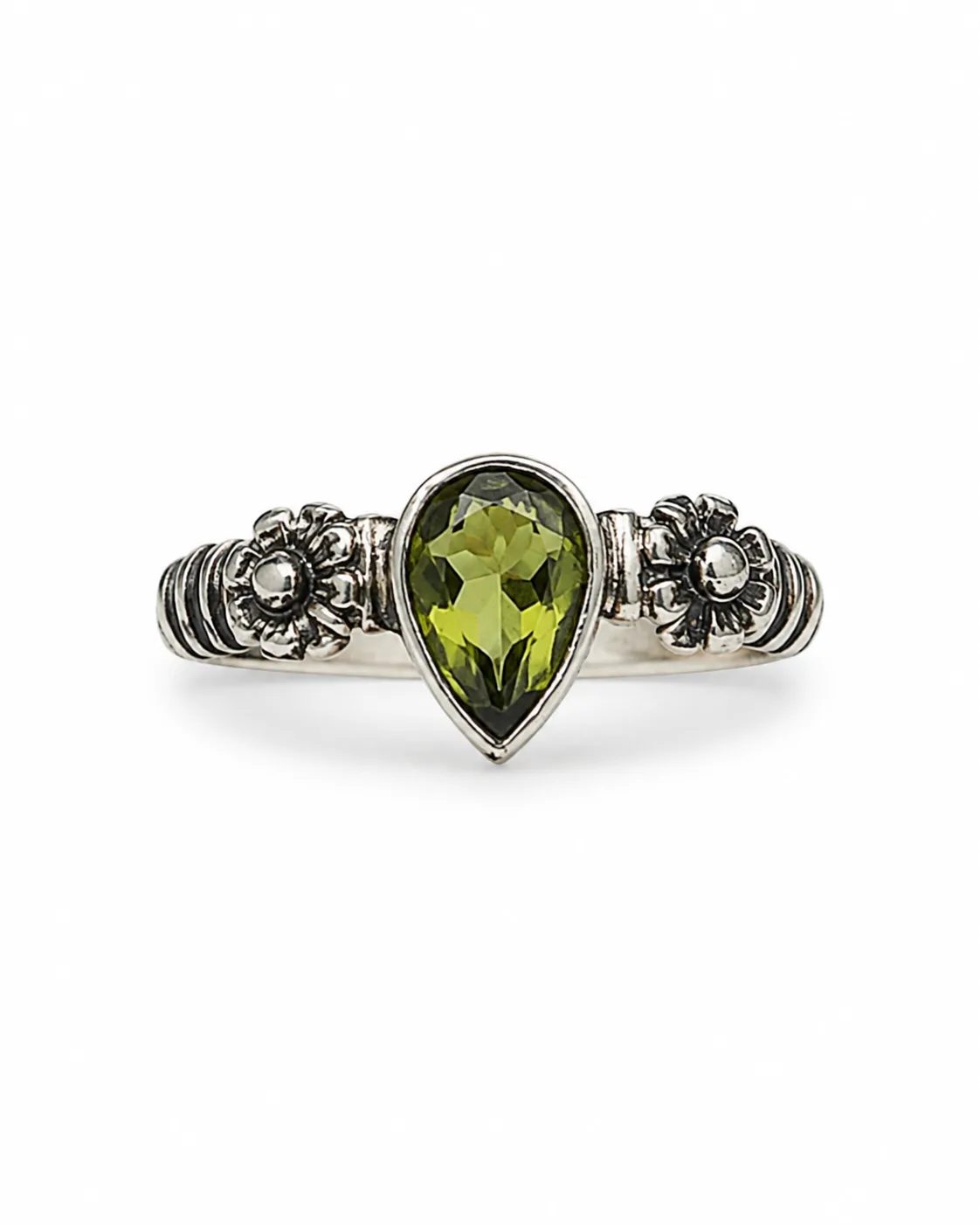 Pear-cut zultanite silver ring with a green faceted gemstone, floral side details and oxidized accents on a white background