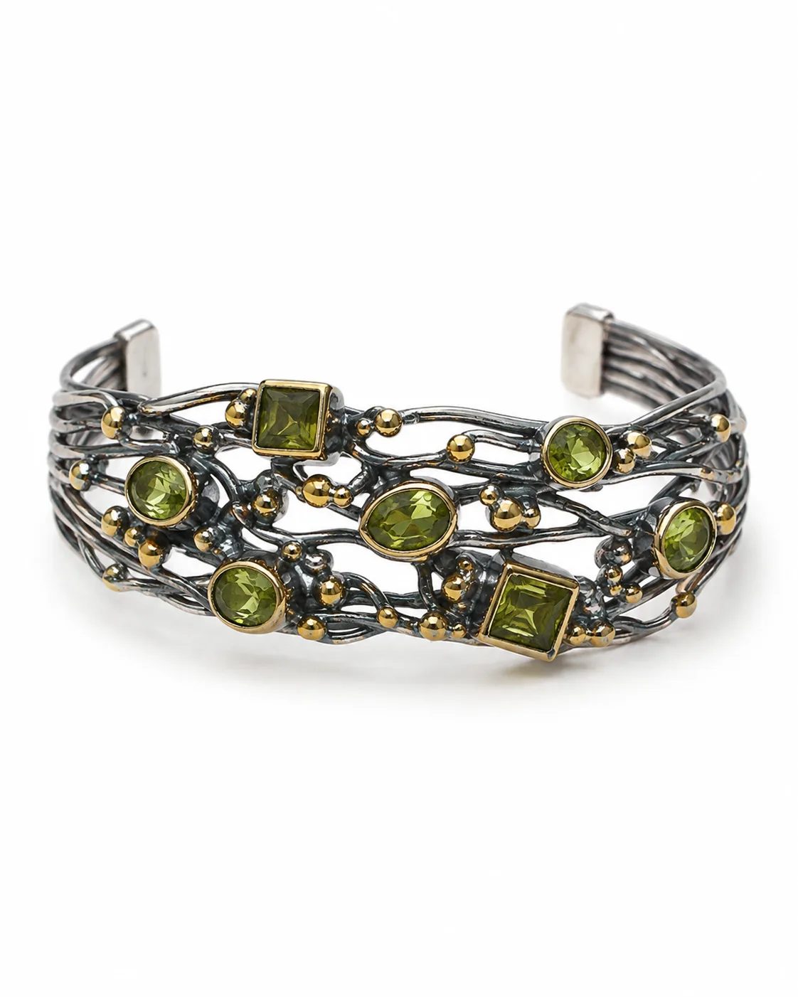Handcrafted sterling silver cuff bracelet with bronze details and green zultanite stones in mixed cuts.