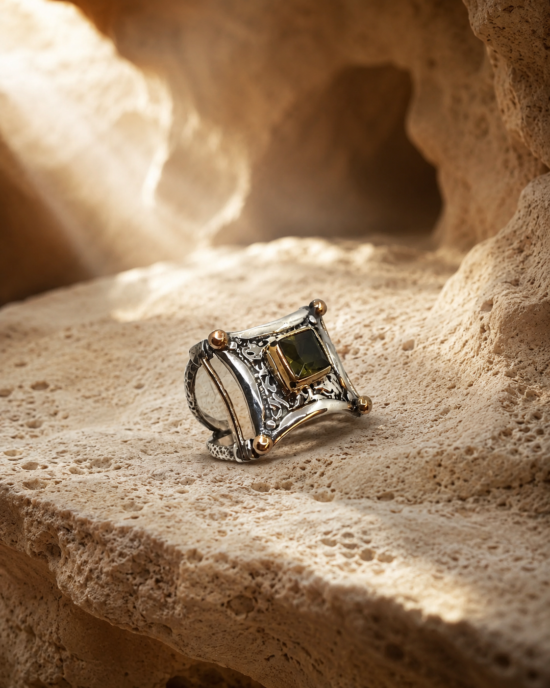 Ornate 925 sterling silver ring with square zultanite stone and bronze-toned details on white background