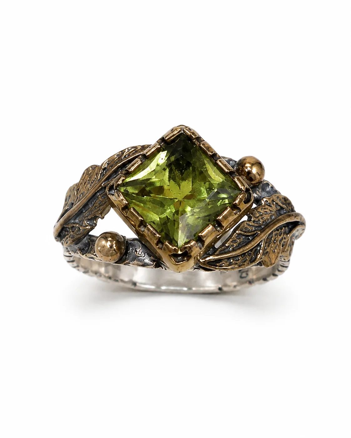 Square-cut zultanite sterling silver ring with a green faceted gemstone, bronze details and botanical leaf motifs on a white background