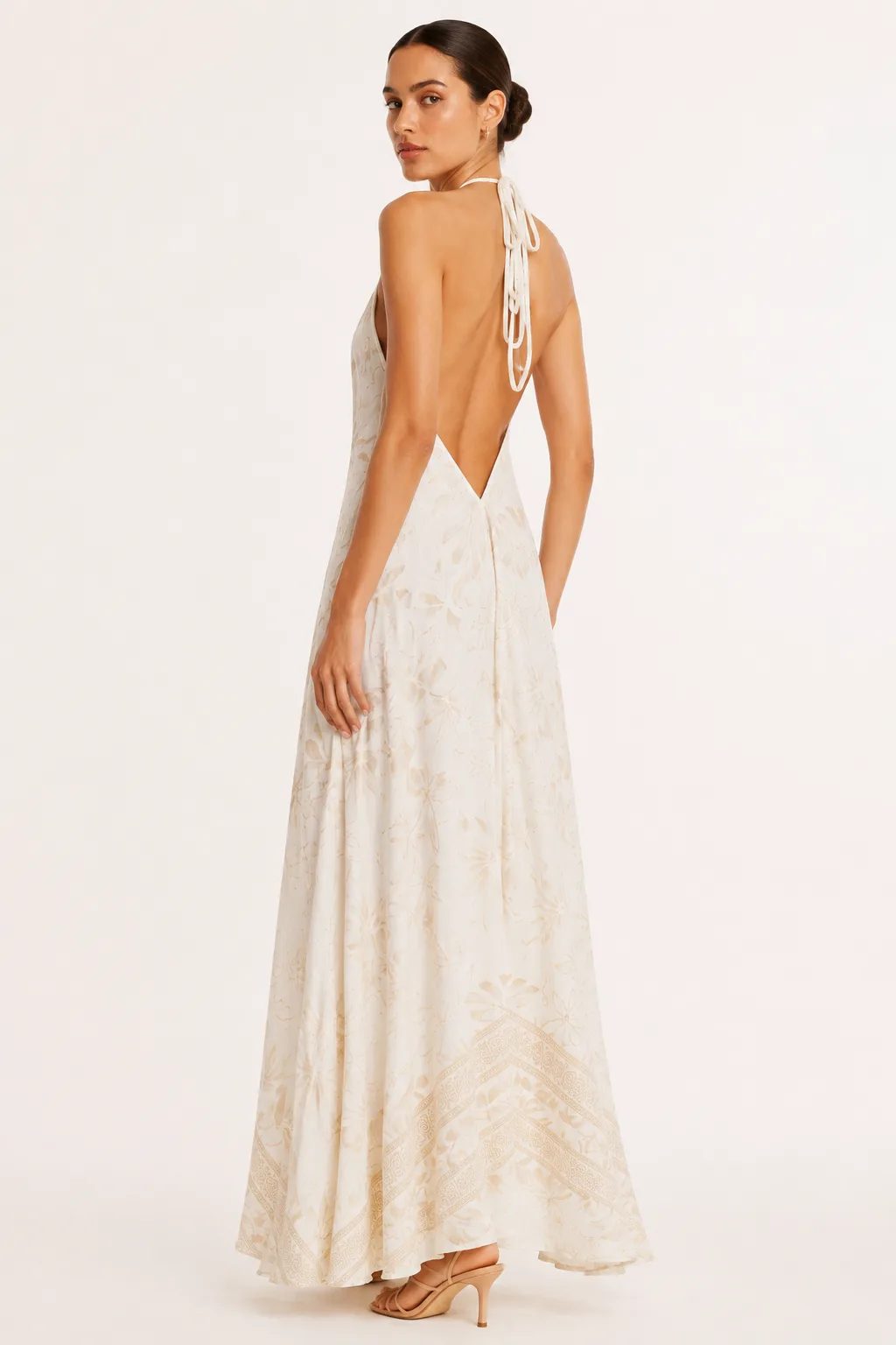 Low open-back ivory silk halter dress