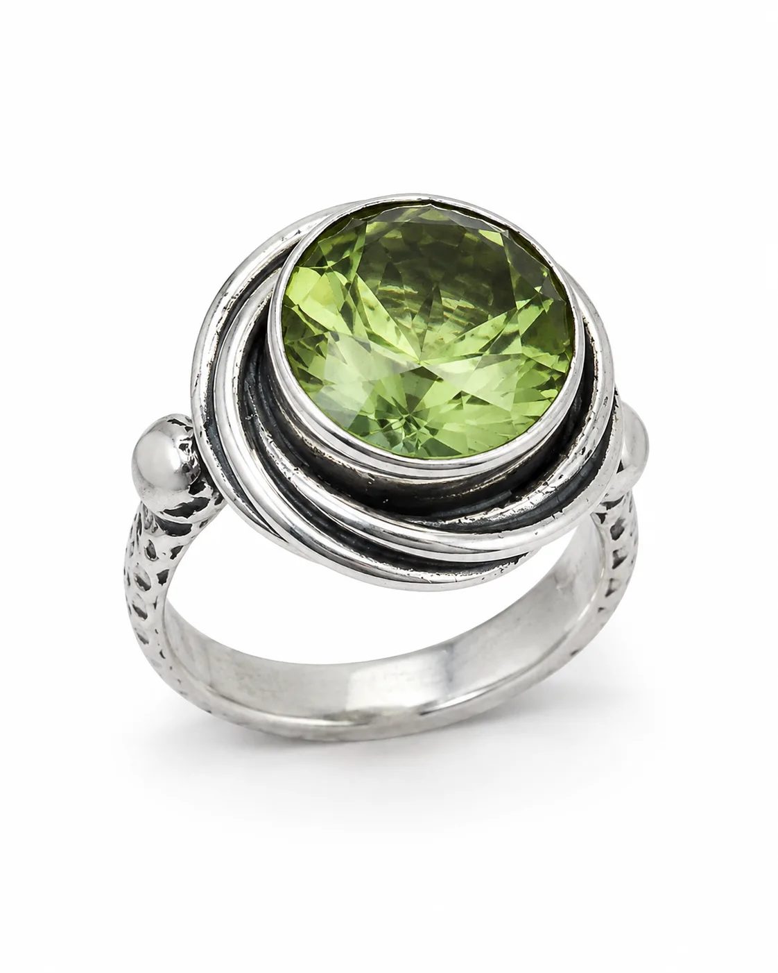 Zultanite silver statement ring with a large round faceted green gemstone in a layered oxidized setting