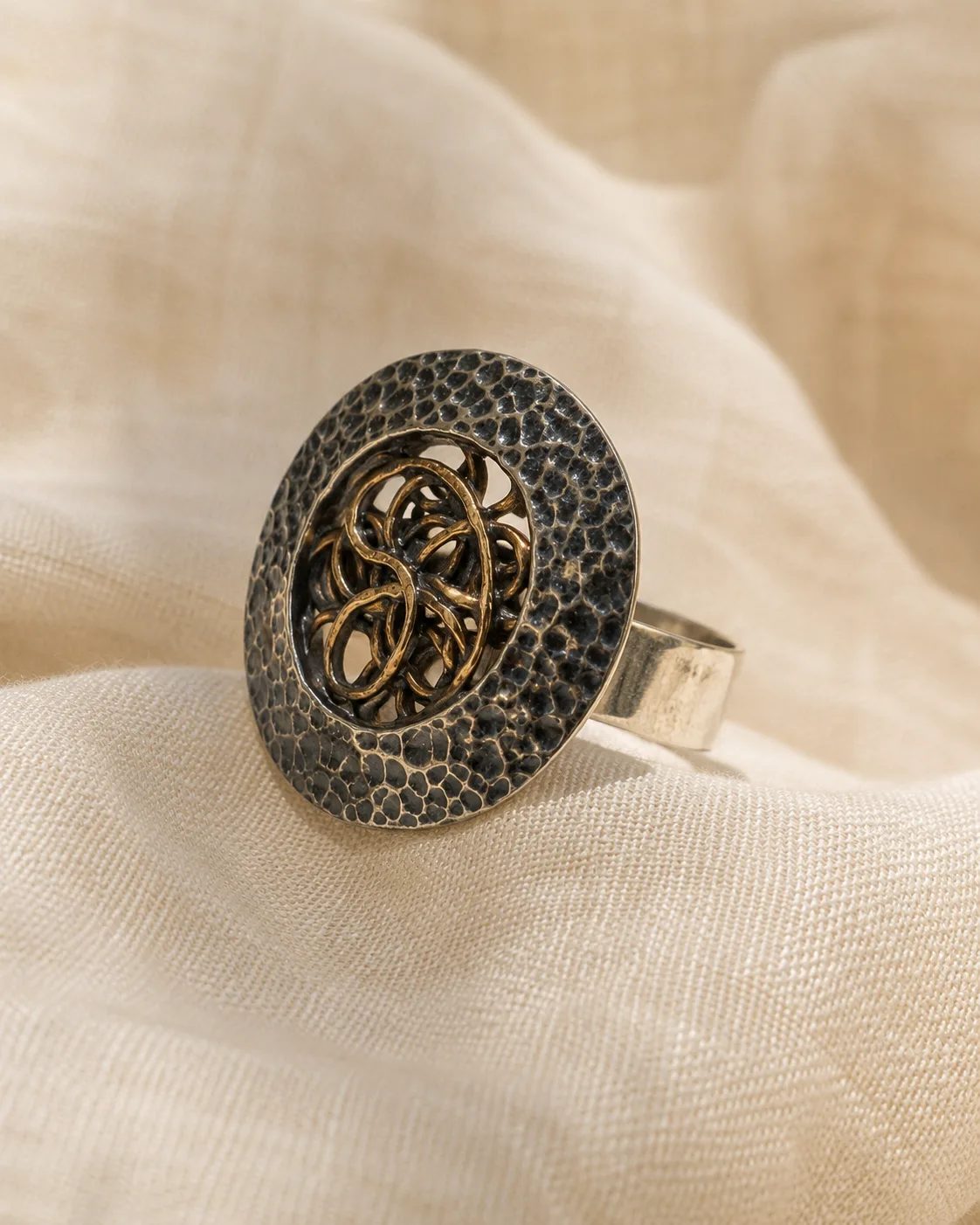 Hammered Silver Statement Ring with Copper Knot Medallion