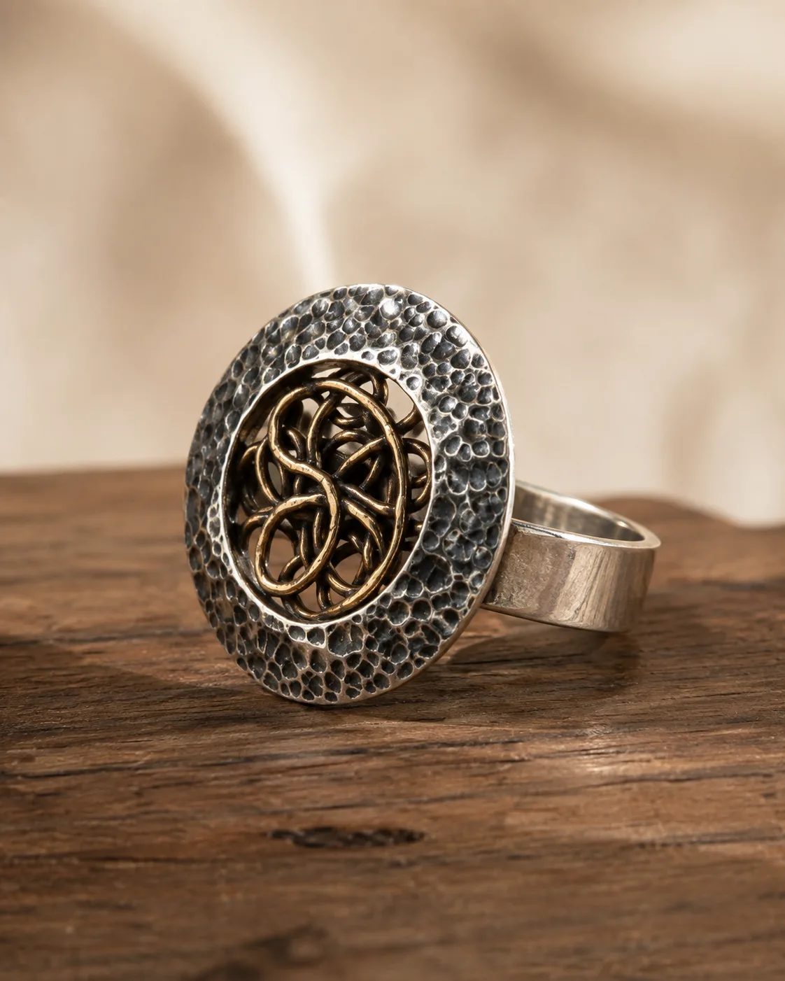 Hammered Silver Statement Ring with Copper Knot Medallion