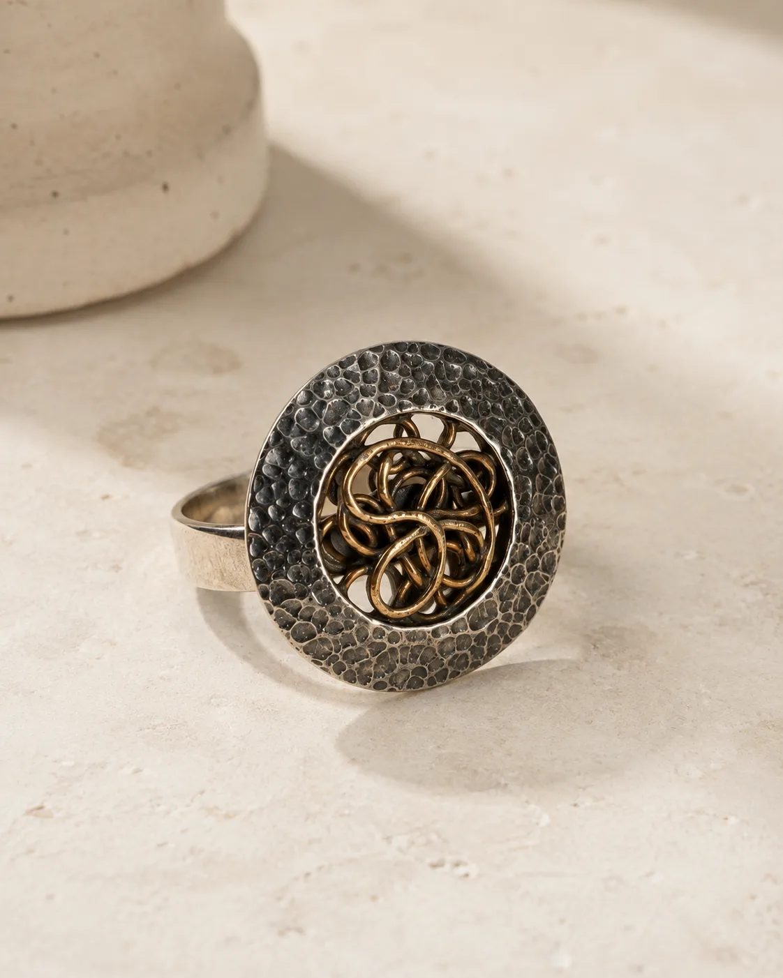Hammered Silver Statement Ring with Copper Knot Medallion
