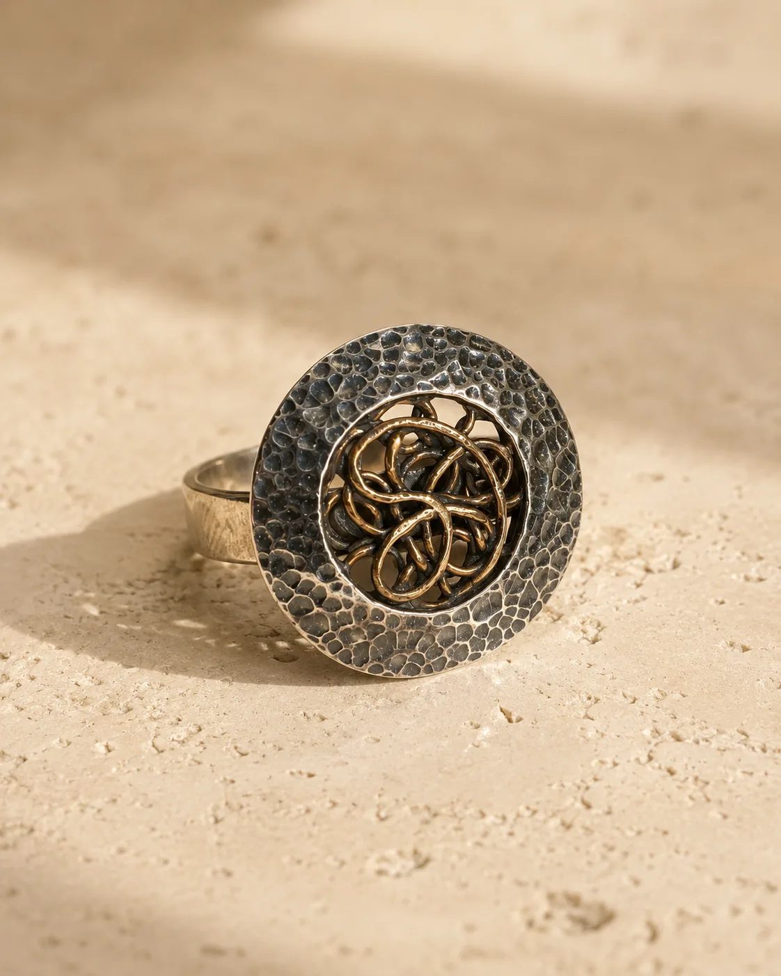 Hammered Silver Statement Ring with Copper Knot Medallion
