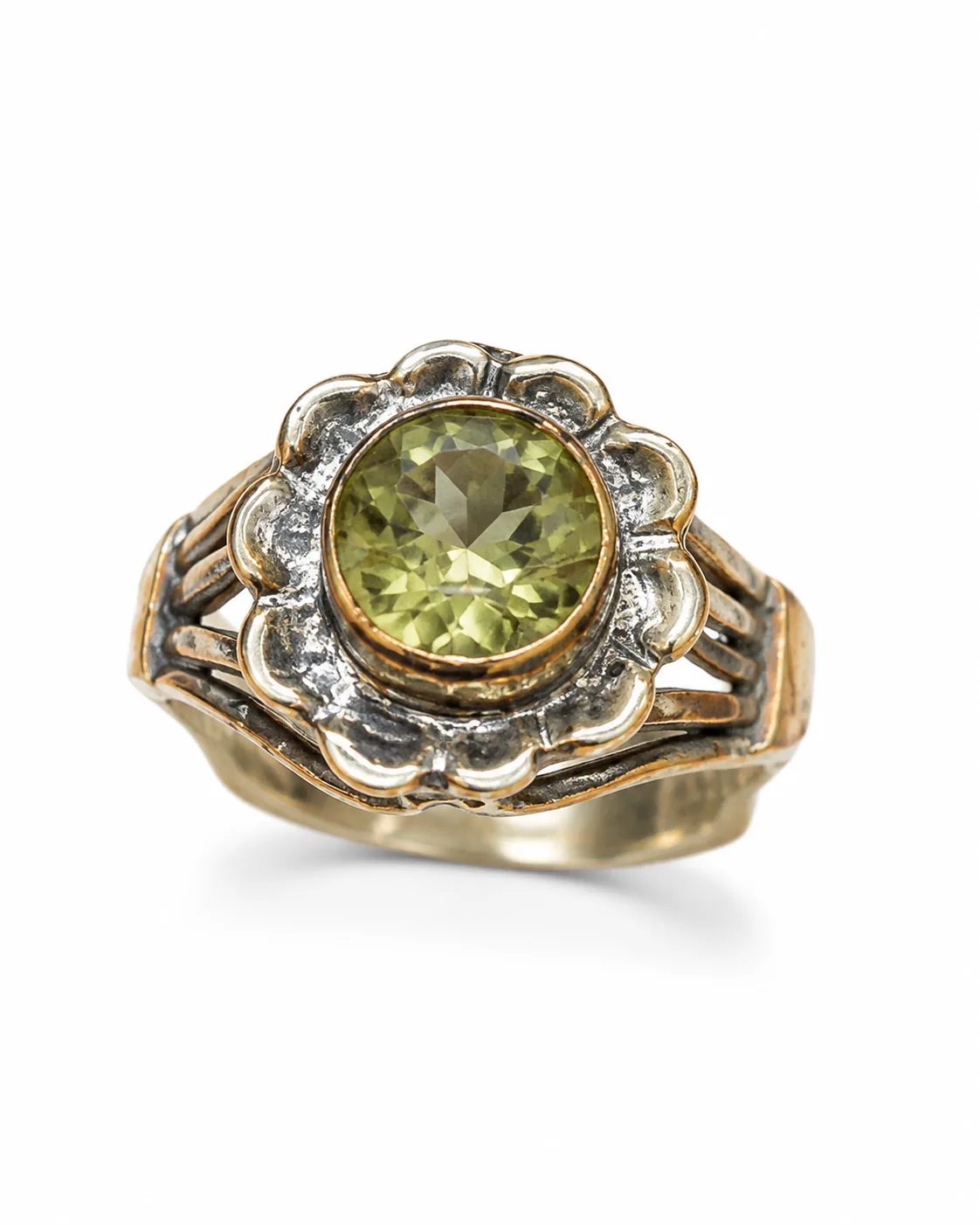 Floral zultanite sterling silver ring with a round green gemstone, sculptural petals and oxidized details on a white background
